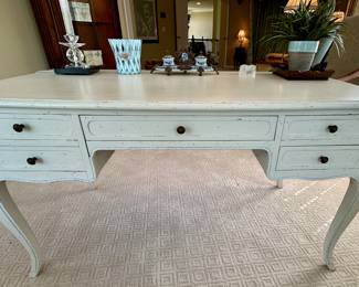 Distressed Painted French Country Desk. Painted white with fine blue outlining. 5 drawer with same style chair with caning and painting on both back and seat. Comfortable seat cushion included. 
