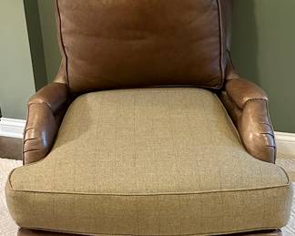 High Quality Pearson brand leather and fabric lounge accent chairs purchased from Merchandise Mart in Chicago. Two in a set with a tuffed fabric ottomon that matches the pane wool fabric on the seat of the chairs. As shown in photos these chairs were originally all leather. They were upholstered with a custom pane wool fabric on the seats and the original leather can be interchanged. Chairs have very substantial wooden legs. The tuffed ottomon has 3 buttons that have uplifted - buttons are there. 
Seat Height - 22 inches 
Seat Depth - 24 inches 
Dimensions - 34 inches wide by 43 inches High&nbsp; &nbsp; 