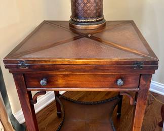 Theodore Alexander 2 Tier single drawer flip-top game Table. Very unique and special piece. 
Height - 29”
Width - All 4 sides the same at 21”
Open - 42” end to end