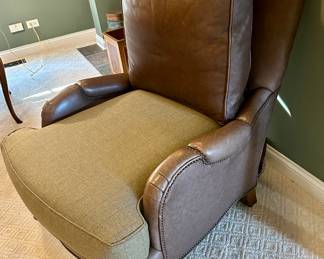 High Quality Pearson brand leather and fabric lounge accent chairs purchased from Merchandise Mart in Chicago. Two in a set with a tuffed fabric ottomon that matches the pane wool fabric on the seat of the chairs. As shown in photos these chairs were originally all leather. They were upholstered with a custom pane wool fabric on the seats and the original leather can be interchanged. Chairs have very substantial wooden legs. The tuffed ottomon has 3 buttons that have uplifted - buttons are there. 
Seat Height - 22 inches 
Seat Depth - 24 inches 
Dimensions - 34 inches wide by 43 inches High&nbsp; &nbsp; 