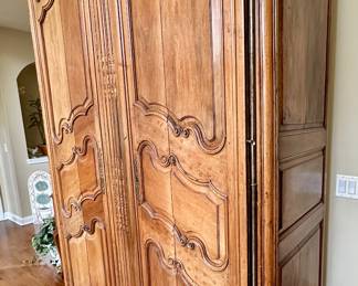 Imported from Normandy, France Circa 1800's..  This One of a Kind Antique Armoire was converted to be a piece of art or easily opened for a functional entertainment furniture piece. Our Homeowners invested over $25,000 in this pie
Height -104 inches 
Width - 58 inches 
Depth - 24 inches 
Will accomodate 61 inch Monitor Imported from Normandy, France Circa 1890's..  This One of a Kind Antique Armoire was converted to be a piece of art or easily opened for a functional entertainment furniture piece. Our Homeowners invested over $25,000 in this piece Height -104"  Width - 58" Depth - 24".  Will accomodate 60" HDTV/Monitor  or make an awesome Bar.  You need to see this.