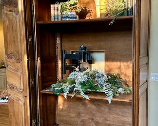 Imported from Normandy, France Circa 1800's..  This One of a Kind Antique Armoire was converted to be a piece of art or easily opened for a functional entertainment furniture piece. Our Homeowners invested over $25,000 in this pie
Height -104 inches 
Width - 58 inches 
Depth - 24 inches 
Will accomodate 61 inch Monitor Imported from Normandy, France Circa 1890's..  This One of a Kind Antique Armoire was converted to be a piece of art or easily opened for a functional entertainment furniture piece. Our Homeowners invested over $25,000 in this piece Height -104"  Width - 58" Depth - 24".  Will accomodate 60" HDTV/Monitor  or make an awesome Bar.  You need to see this.