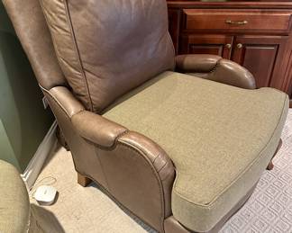 High Quality Pearson brand leather and fabric lounge accent chairs purchased from Merchandise Mart in Chicago. Two in a set with a tuffed fabric ottomon that matches the pane wool fabric on the seat of the chairs. As shown in photos these chairs were originally all leather. They were upholstered with a custom pane wool fabric on the seats and the original leather can be interchanged. Chairs have very substantial wooden legs. The tuffed ottomon has 3 buttons that have uplifted - buttons are there. 
Seat Height - 22 inches 
Seat Depth - 24 inches 
Dimensions - 34 inches wide by 43 inches High&nbsp; &nbsp; 