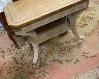 Italian white washed table at the foot of the High French 3/4 bed HOOK RUG ON THE FLOOR