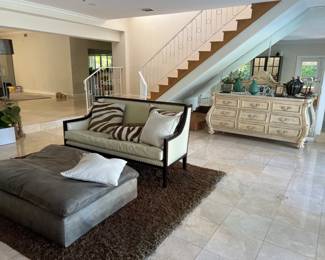 Cream leather sofa was $750 now $400.  Restoration Hardware leather ottoman was $400 now $200,