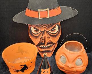 Vintage Halloween Collectibles. Paper mache pumpkin, Hazel Atlas glass Halloween bowl, die cut witch, and paper hat.