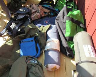 Stacks of Duffel bags, rucksacks, backpacks - LL Bean, REI