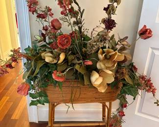 Flowers are priced separately from the rattan planter.