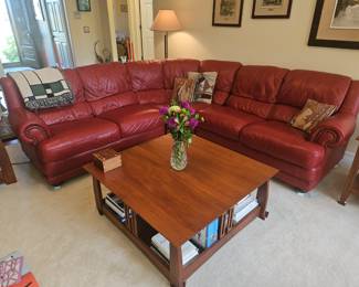 Red Leather sectional, available for early purchase at $750.00. please text 734-730-6266 if you are interested.