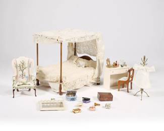 FANCY DOLLHOUSE MINIATURE GROUPING | Fancy dollhouse miniature furnishings and accessories, including a four poster bedstead with lace bedding and canopy, a needleopint wingback chair, brass coat rack, a vanity table covered with accessories with mirror and Biedermeier-style side chair, plus minaiture perfume bottles, makeup objects, and jewelry boxes with miniature jewelry, including a faux boule-inlay wood box (l. 1.75 in.) - l. 7 x w. 5.5 x h. 7 in. (bed)
