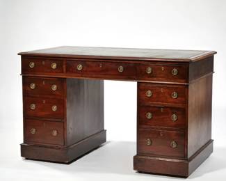 ENGLISH MAHOGANY PEDESTAL WRITING DESK OF DESIRABLE SIZE | Very fine, having a rectangular top with gilt-tooled green leather writing surface, brass engraved ring pulls, molded edge projecting over 3 drawers over 2 pedestals each with 3 drawers  - l. 48 x w. 26.25 x h. 30 in.