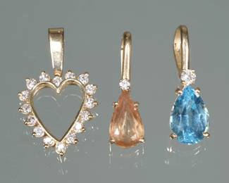 (3pc) GEMSTONE & 14K GOLD PENDANTS | Including an open heart shaped pendant, mounting, small, full cut diamonds (1 in., 2.3g); Attendant with a pair modified cut citrine (1 in., 1.9g); independent with a pair modified blue stone, probably aquamarine and a full cut diamond (1 in., 2.7g) all tested 14k, no apparent markings.
