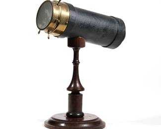 CHARLES G. BUSH KALEIDOSCOPE | An American C. G. Bush & Co. tabletop kaleidoscope mounted on a wood stand, Prov. R.I., pat. Nov. 11 - 1873 - l. 10 x h. 14 in.
