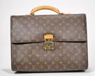 LOUIS VUITTON SOFT BRIEFCASE | Serviette Conseil In the "LV" monogram pattern with brass hardware - l. 15.5 x w. 14 x h. 4 in.
