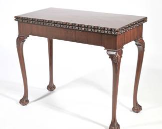19TH CENTURY ENGLISH CARVED "ACCORDION" GAMES TABLE | English, 18th/19th-century oblong egg and dart carved edge, inset leather top, double hinged collapsing sides raised on four cabriole legs with shell carvings at the knee terminating in ball and claw feet - l. 36 x w. 36 x h. 29.5 in. (opened)