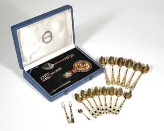 (21pc) RUSSIAN GILT & ENAMEL SILVER SPOONS | Including a four piece silver and enamel tea spoon set, including a tea scoop, spoon, strainer, and small cocktail fork, with black and red enameled handles in a presentation case, each with maker's mark and stamped "916" with a star (together 3.5 ozt); plus 875 silver, including a set of six teaspoons with black and blue enameled floral handles, a set of eight demitasse spoons with enameled art deco style handles, two similar cocktail forks (one gilt, one not gilt), and a small gilt salt spoon, each with maker's mark and 875 fineness mark, together 9.05 ozt - l. 5.5 in. (largest)

