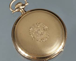 WALTHAM 14K GOLD POCKET WATCH | In an engine turned and monogrammed gold case, having Arabic numerals with a sub-seconds dial, case no. 5340515, marked Keystone / 14K; gross weight 67.5g
 - h. 2.5 x dia. 1.75 in.