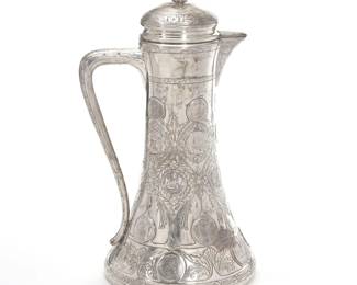 MONUMENTAL GERMAN SILVER COIN MOUNTED TANKARD | Carl Frey & Sohne, Breslau,  19th century; A tapering form tankard with a squat base and hinged lid mounting 27 antique silver coins; base marked "Frey & So. / 800" and with crescent moon mark
90.1 ozt - w. 10 x h. 19.5 in.