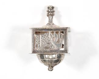 STERLING SILVER DREIDEL | A silver dreidel with openwork sides marked "Israel st 925"; 1.75 in., 0.73 ozt