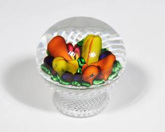 SAINT-LOUIS MILLEFIORI FRUIT BASKET PAPERWEIGHT | Designed as a basket of fruit suspended in a clear crystal orb, base Interior marked "S L 1985" - l. 3 x dia. 3 in. (overall)
