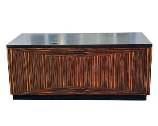 MANNER OF LEON ROSEN ROSEWOOD EXECUTIVES DESK | An impressive bespoke executives desk, two drawers over two cabinet doors, one with lower slide out tray and grillwork door (for a computer tower); modular construction, currently disassembled as pictured - l. 70 x w. 32 x h. 29 in.
