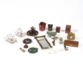 NATASHA, ANRI, & OTHER MINIATURES | Miniature dollhouse decorative accessories, including a Natasha green painted footstool signed and dated 1980, a Natasha lacquered tole style tray signed on verso, "NAT. 90"; a miniature Anri hand-painted pintail decoy, signed on the bottom; a painted tabernacle mirror; a gilt painted waste basket, indistinctly signed on the bottom; a silver plated tea set and a pair of Reutter porcelain tureen serving sets; three miniature kaleidoscopes (one with clean break); a gilt mantel clock; a boxed dual pistol set, signed with initials WSD on the box; a wooden tea caddy and a utensil box with forks, spoons, and knives; a green Fabrege-style egg in a cloche; and small Lalique style glass figures on a green marbled tray, signed  - w. 1.75 x h. 3 in. (mirror)
