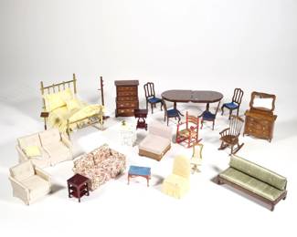 MISC. DOLLHOUSE MINIATURE FURNITURE | A collection of miniature dollhouse furniture, including: a brass bed, a double pedestal extension dining table with leaf, four side chairs, a red painted rocking chair, red foot stool, a wooden rocking chair, a George Spencer Collection chest of drawers with mirror [detached], a white side table, a plant stand, three dark wood side tables [one with missing leg], a gold loveseat with matching armchair, an Asian style settee, a mid-century style caned lounge chair, a floral upholstered loveseat, a tall chest of drawers, a yellow chair, and a coat rack - l. 6.5 x w. 5 x h. 5.25 in. (bed)
