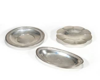 (3pc) STERLING SILVER TRAYS | Including an oval bread tray, a 10.5-inch lotus rim plate, and a Garden Silversmiths round tray with reticulated rim [with dents], each marked "Sterling"; all together 32.85 ozt
 - dia. 11.5 in. (largest)