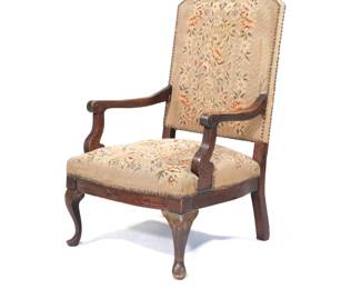 ANTIQUE NEEDLEPOINT FLOWER ARMCHAIR | Carved wood armchair with floral needlepoint upholstery with riveted border over cabriole front legs - l. 24.5 x w. 22 x h. 38 in.