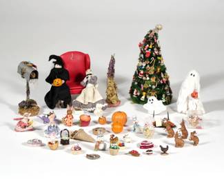 HOLIDAY DOLLHOUSE MINIATURES | A collection of dollhouse miniature decorative objects, comprising mostly holiday decorations, including a Christmas tree with ornaments, Halloween jack-o-lanterns, Easter decor, Valentines decor, Fall-themed objects, etc.
 - h. 7 x dia. 3.5 in. (Christmas tree)