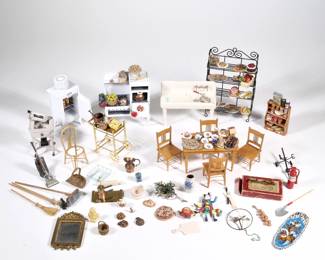 DOLLHOUSE KITCHEN COLLECTION | An extensive collection of miniature dollhouse kitchen fixtures, furniture, and accessories, including American Miniatures diecast stove, General Electric refrigerator / ice box, and meat grinder; a porcelain sink (l. 5 in.), a baker's rack, brass bar cart, wall shelf, table and chairs, and many food accessories, including miniature labeled packaged foods and food served on porcelain plates - l. 4.5 x w. 2.5 x h. 5 in. (stove)