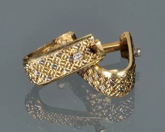 PAIR DIAMOND & 18K GOLD CUFFLINKS | Designed as woven 18k white and yellow god mounting two small melee diamonds, bar clasp with internal spring closure; 7/8 in., 12.8g; marked "750"