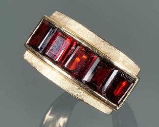GARNET & 14K GOLD RING | Designed as five nicely matched channel set garnets (6 x 4.75 x 3 mm, each approx.), mounted in a line in a 14k yellow gold ring; size 8.5, 13.3g
