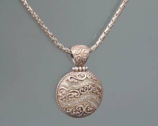 EFFY JEWELRY DIAMOND, GOLD, & STERLING PENDANT NECKLACE | Designed as a round sterling engraved pendant, mounting lines of Mallett diamonds with gold rope, work and embellishments suspended from Sterling braided link chain with a toggle clasp; necklace 18 in., pendant 1 in., 36.4g total weight.