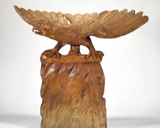 FOLK ART EAGLE WOOD CARVING | Carved wood sculpture of an eagle perched on a rock formation, no apparent signature.  - l. 31 x w. 11.5 x h. 27.5 in.
