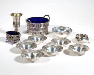 (11pc) SMALL STERLING DISHES | Sterling silver, including a set of 6 nut dishes, a cobalt glass lined bowl, a cobalt lined salt dish, a small footed salt, a coin inset bowl, and a small bud base; total silver weight 14.4 ozt - dia. 4.5 in. (cobalt lined bowl)