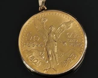 1821-1923 MEXICAN 50 PESO GOLD COIN | 37.5gr ORO PURO, in a (tested to) 14k gold soldered surround with bail; 44.4g total weight - dia. 1.5 in.