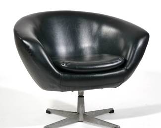 MID CENTURY LOUNGE ARMCHAIR | Black leatherette/ vinyl covering, single cushion on a swiveling cast aluminum quadruped base, surprisingly comfortable - l. 27 x w. 33 x h. 27 in.

