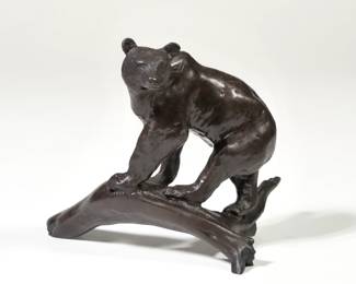 (AFTER) CHARLES MARION RUSSELL (AMERICAN, 1864-1926)  | Grizzly Bear. Bronze. Signed with initials "CMR" and with artist's skull device; no apparent edition number or foundry mark.
