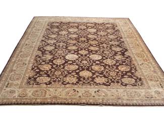 FINE OVERALL PATTERN TABRIZ ROOM SIZED CARPET | Late 19th/ early 20th century, having a rich coffee brown ground with an overall pattern of vines, lotus, iris, peony, and lily blossoms in reserves, with a complementary border of flowers - l. 17 x w. 12 ft.