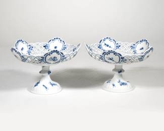 PAIR MEISSEN BLUE FLOWER COMPOTES | Compotes / tazza with openwork rims in "blue flower" pattern with insects, each with underglaze blue crossed swords mark to bottom of both bowl and base
 - h. 6.25 x dia. 9 in. (each)
