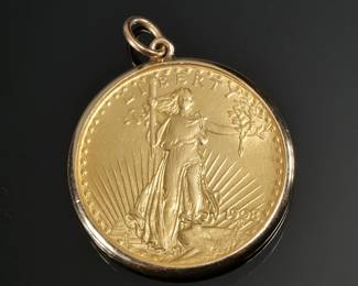 1908 SAINT-GAUDENS DOUBLE EAGLE "NO MOTTO" | Obverse showing liberty walking with torch and branch, reverse with flying eagle, mounted in a soldered gold surround; total weight 36.1g

