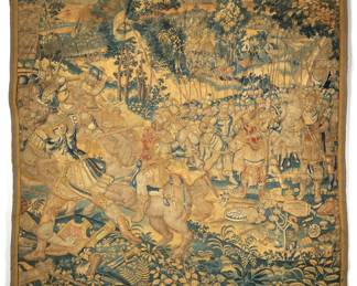 17TH CENTURY FLEMISH VERDURE TAPESTRY | Depicting a battle scene with figures on horseback, and an army of men holding spears. h. 71 x w. 70 in. (h. 180 x w. 178 cm)

