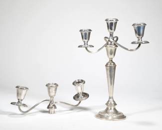 NEWPORT STERLING CANDLE HOLDERS | Comprising a single candlestick holder designed in three separate pieces (bottom piece does not secure well), with two three-arm candelabra that attach to the candlestick; all pieces cement weighted
 - l. 11.5 x h. 4 in. (candelabra alone)


