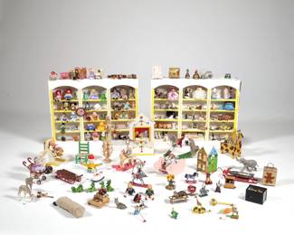 DOLLHOUSE MINIATURE PLAYROOM | Dollhouse miniature playroom furniture and extensive collection of miniature toys, including: two triple bookshelves filled with toys and figures, a miniature toy dollhouse, a puppet theater, rocking chairs, and many loose toys, including: blocks, miniature Barbie dolls in boxes, a Breyer horse in box, jack-in-the-boxes, dolls, chalkboard, toy trains, pull along toys, instruments, miniature board games (Monopoly and Candyland), and more - l. 9.25 x w. 1.25 x h. 7.25 in. (ea. bookcase)