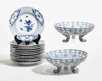 (14pc) MEISSEN RETICULATED CHINA | Including twelve 8-inch plates with openwork rims [one with old repair to reticulated rim] and two footed reticulated serving bowls with dolphin feet [one with repaired foot, the other with detached but present foot]
 - h. 4 x dia. 9.5 in. (footed bowls)

