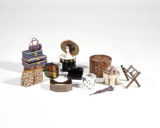 DOLLHOUSE MINIATURE LUGGAGE & HAT BOXES | Including an Hermes hat box, a Bonwit Teller box, an LV monogram open box, a miniature hat display stand, a luggage rack, a set of plaid luggage with matching umbrella, and more.
