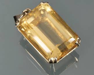 A LARGE RECTANGULAR CUT CITRINE PENDANT | Designed as a ( x 18.4 x 13.6 mm) set in (tested to) 14k gold surround; 1.25 in., 15.8g total weight; no apparent markings.
