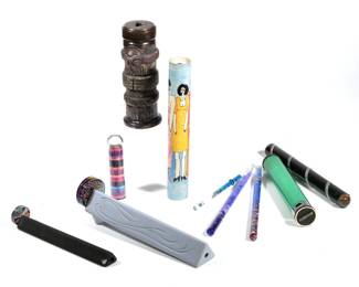 (10pc) MISC. KALEIDOSCOPES | Contemporary kaleidoscopes, including a totem-form ceramic kaleidoscope, a gray ceramic kaleidoscope with triple end piece with intaglio signed "Protctor" and dated 1987, a black kaleidoscope with stained glass end piece, a hand-painted mid-century kaleidoscope, three kaleidoscope wands, and others. - l. 11.25 x h. 3.25 in. (largest)

