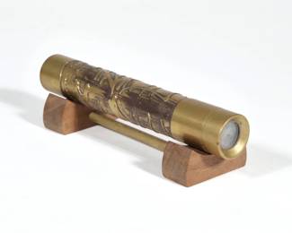 STEPHEN AUGER KALEIDOSCOPE | Textured brass cylinder kaleidoscope, signed with artist's initials and dated 1987 at the eyepiece, numbered 4749. - l. 6.25 x dia. 1 in.

